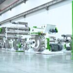 Pellet machines in a manufacturing workshop awaiting project-specific compliance review